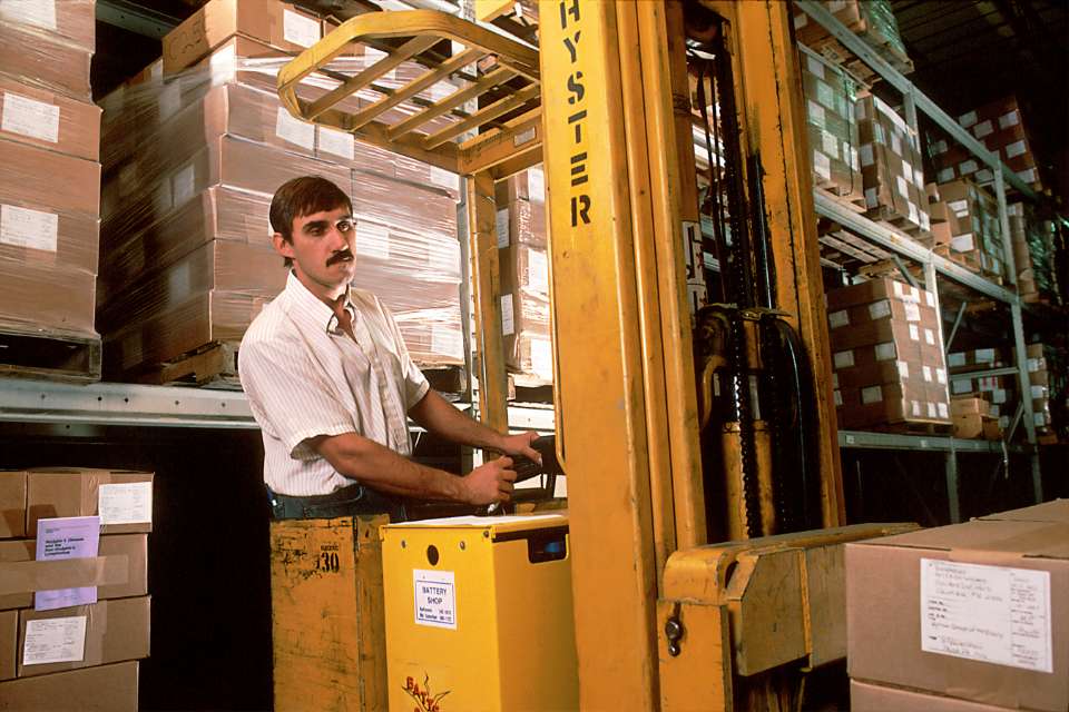 A man unloading the cargo